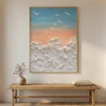 Textured contemporary seascape hand-painted canvas with impasto white waves, warm sunset gradient sky and flying birds, styled in modern entryway