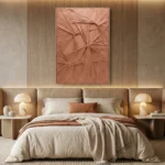Textured abstract hand-painted canvas in terracotta and blush tones with radiating gestural brushwork, contemporary bedroom setting