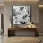 Textured abstract hand-painted canvas with swirling monochrome brushstrokes in black and white, contemporary entryway