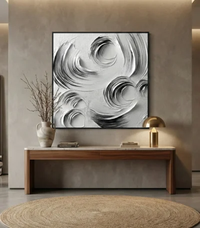 Textured abstract hand-painted canvas with swirling monochrome brushstrokes in black and white, contemporary entryway