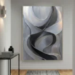 Gestural abstract hand-painted canvas with flowing organic forms in monochrome grays and blacks, contemporary entryway