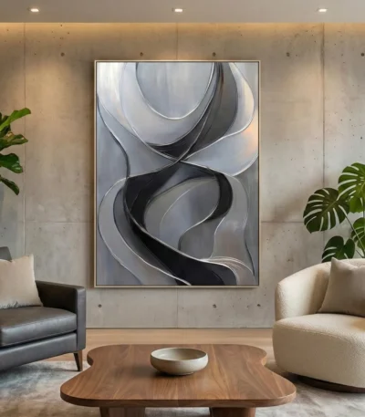 Abstract hand-painted canvas with flowing curved forms in charcoal, grey and cream tones, contemporary living space