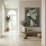 Contemporary figurative hand-painted canvas with geometric profile and abstract facial features in charcoal and cream, modern entryway