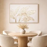 Minimalist hand-painted canvas depicting delicate dried botanicals in cream and gold tones, contemporary dining space