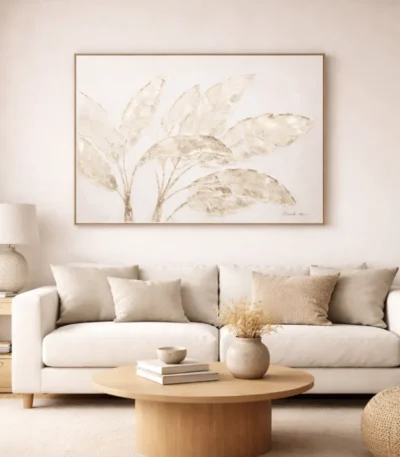 Minimalist hand-painted canvas depicting delicate botanical leaves in muted cream and taupe tones, contemporary living space