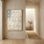 Minimalist textured hand-painted canvas with cream and pale pink geometric squares in grid composition, modern hallway