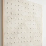 Harmonized Forms textured wall art shown framed on the wall in a styled interior