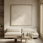 Textured minimalist hand-painted canvas featuring embossed circular patterns in cream and beige tones, contemporary living space