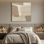Textured abstract hand-painted canvas with geometric composition in cream, taupe, and sand tones, modern bedroom