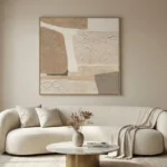 Textured abstract hand-painted canvas with layered cream and taupe geometric forms, contemporary living space