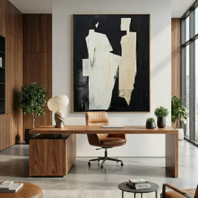 Minimalist abstract hand-painted canvas in cream and black with gestural forms, modern office space