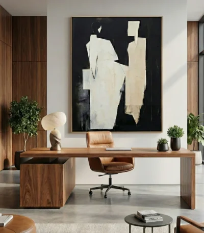 Minimalist abstract hand-painted canvas in cream and black with gestural forms, modern office space