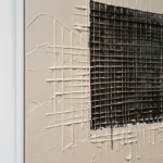 Charred Grid textured wall art shown framed on the wall in a styled interior