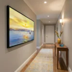 Impressionist seascape hand-painted canvas with golden sunset, sailing boats, and dynamic brushwork in warm yellows and cool blues, hallway setting