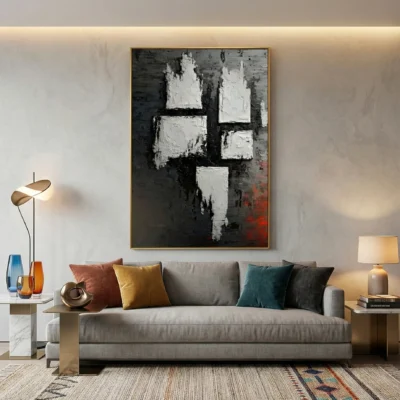 Gestural abstract hand-painted canvas with white impasto marks and charcoal tones, accented by deep red undertones, contemporary living space
