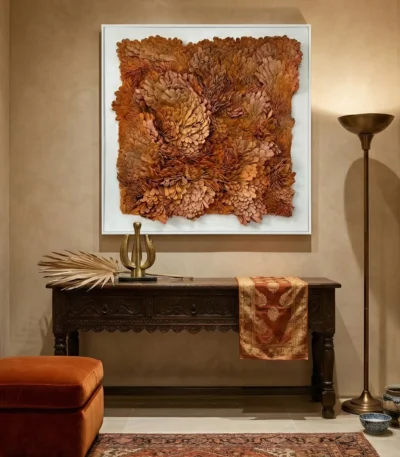 Textured abstract hand-painted canvas in warm terracotta and golden ochre tones, contemporary entryway