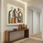 Contemporary abstract hand-painted canvas depicting stylized figures in earthy terracotta, navy, and ochre tones, entryway setting