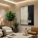 Minimalist abstract hand-painted canvas in monochrome black and white with gestural brushwork, contemporary living space
