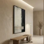 Abstract hand-painted canvas in monochromatic black, white, and grey with layered gestural brushstrokes, minimalist entryway