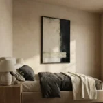 Minimalist abstract hand-painted canvas with gestural black and cream brushstrokes on divided composition, contemporary bedroom