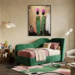 Gestural abstract hand-painted canvas featuring two stylized figures with magenta blooms and green elongated forms, warm earth and black tones, modern bedroom setting