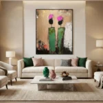 Contemporary abstract hand-painted canvas depicting two stylized figures with magenta heads and green bodies, textured earth tones, modern living space