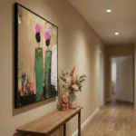 Contemporary abstract hand-painted canvas featuring stylized cacti with magenta blooms and green stems, distressed neutral palette, hallway setting