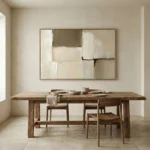 Minimalist abstract hand-painted canvas with layered cream and taupe brushstrokes, modern dining space