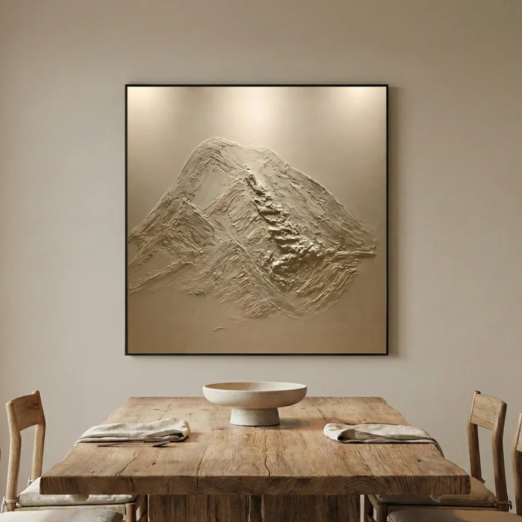 Textured abstract hand-painted canvas depicting layered mountain peaks in monochromatic cream and taupe tones, contemporary dining space
