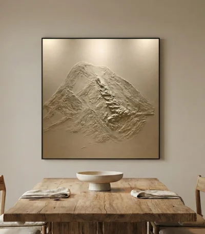 Textured abstract hand-painted canvas depicting layered mountain peaks in monochromatic cream and taupe tones, contemporary dining space