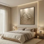 Textured monochrome hand-painted canvas depicting layered mountain landscape in cream and taupe tones, contemporary bedroom