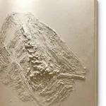 Tan Summit textured wall art shown framed on the wall in a styled interior