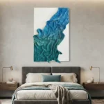 Textured abstract hand-painted canvas in layered teal and blue gestural brushstrokes, contemporary bedroom setting