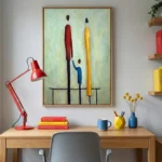 Contemporary figurative hand-painted canvas depicting three abstracted figures in red, yellow, and blue tones, styled workspace