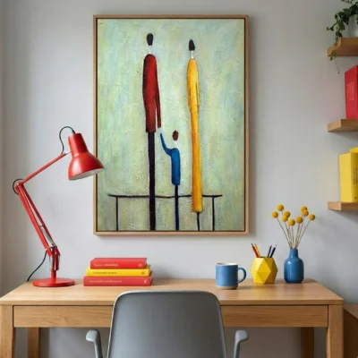 Contemporary figurative hand-painted canvas depicting three abstracted figures in red, yellow, and blue tones, styled workspace