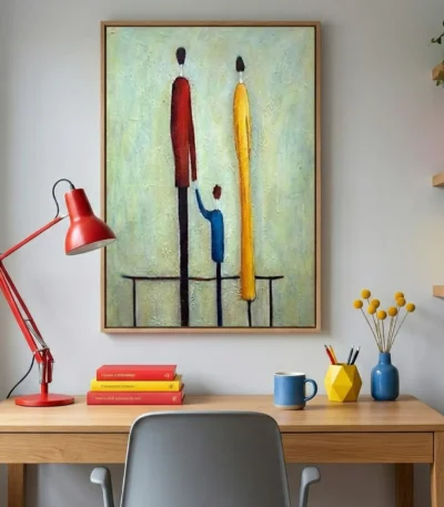 Contemporary figurative hand-painted canvas depicting three abstracted figures in red, yellow, and blue tones, styled workspace