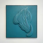 Textured hand-painted canvas depicting flowing feathered wings in layered teal and blue-grey tones