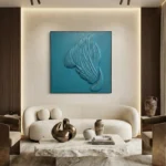 Minimalist hand-painted canvas depicting an abstract feathered form in layered teal and grey tones, contemporary living space