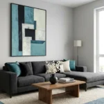 Contemporary abstract hand-painted canvas in layered turquoise, cream and black geometric forms, modern living space