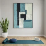 Layered abstract hand-painted canvas in teal, cream and charcoal geometric blocks with textured finishes, contemporary yoga studio