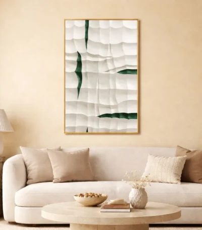 Minimalist hand-painted canvas with layered white textured strokes and deep green gestural marks, contemporary living space