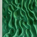 Textured abstract hand-painted canvas in layered emerald green with organic sculptural forms and dimensional relief details