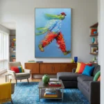 Gestural abstract hand-painted canvas depicting dynamic figure in vibrant red, yellow, and blue brushstrokes, contemporary living space