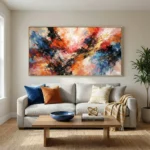 Gestural abstract expressionist hand-painted canvas in vibrant reds, blues, and golds with dynamic brushstrokes, contemporary living space