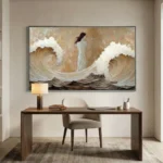Textured figurative hand-painted canvas depicting woman amid crashing waves in cream and warm earth tones, contemporary workspace