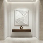 Minimalist abstract hand-painted canvas with nested geometric squares in monochromatic white and gray tones, contemporary entryway