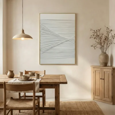 Minimalist abstract hand-painted canvas with intersecting linear brushstrokes in soft grey and white tones, dining space