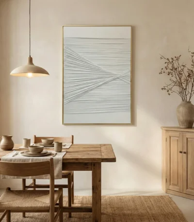 Minimalist abstract hand-painted canvas with intersecting linear brushstrokes in soft grey and white tones, dining space