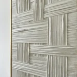 Woven Lattice textured wall art shown framed on the wall in a styled interior