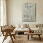 Textured abstract hand-painted canvas with interlocking linear patterns in soft grey and cream tones, contemporary living space
